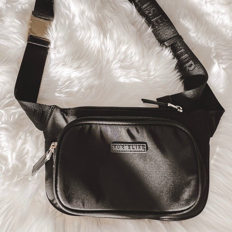 Black belt bag on a rug