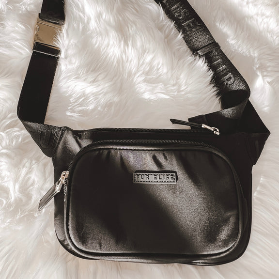 Black belt bag on a rug